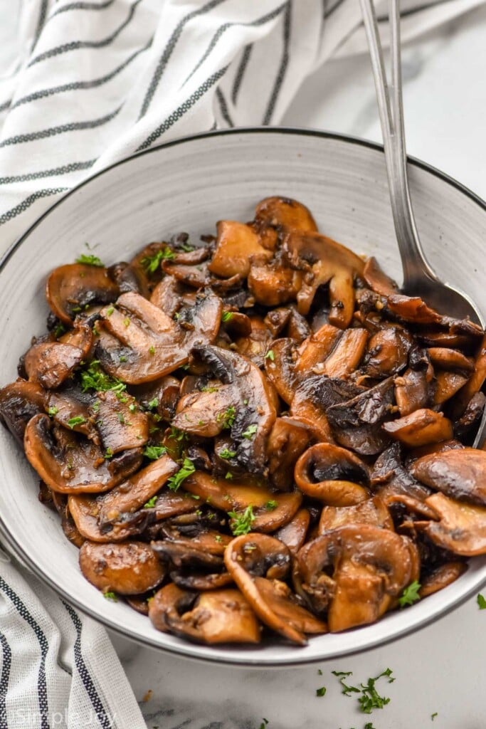 Bowl of Sautéed Mushrooms with a spoon
