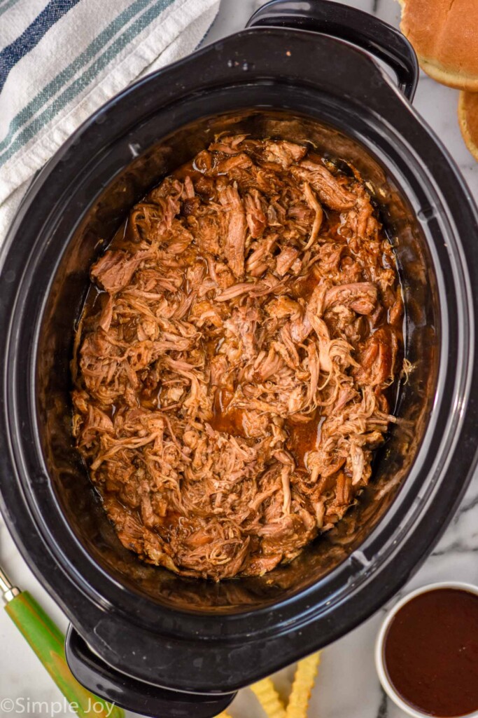 Overhead view of a slow cooker of Crock Pot Pulled Pork recipe