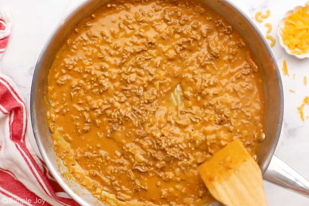 a skillet with meat and sauce to make hamburger helper