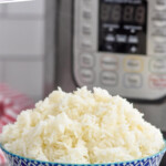 Pinterest graphic for Instant Pot Rice. Says "super easy Instant Pot Rice simplejoy.com" Image shows a bowl of cooked rice with an instant pot sitting in background
