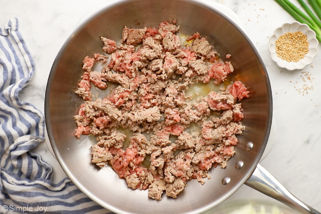overhead of ground turkey being cooked in a skillet