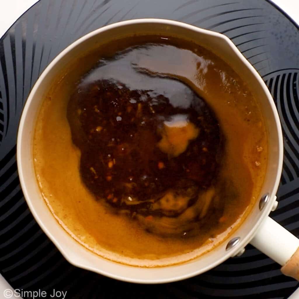overhead of teriyaki sauce simmering in a pan