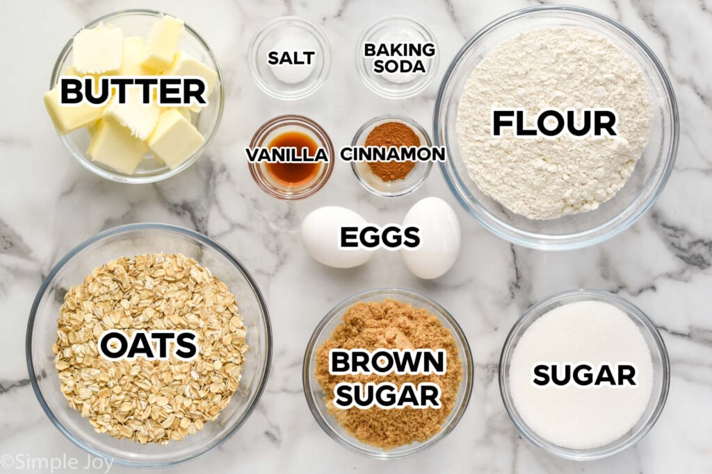 overhead of oatmeal cookie recipe ingredients with label of what it is written above it.