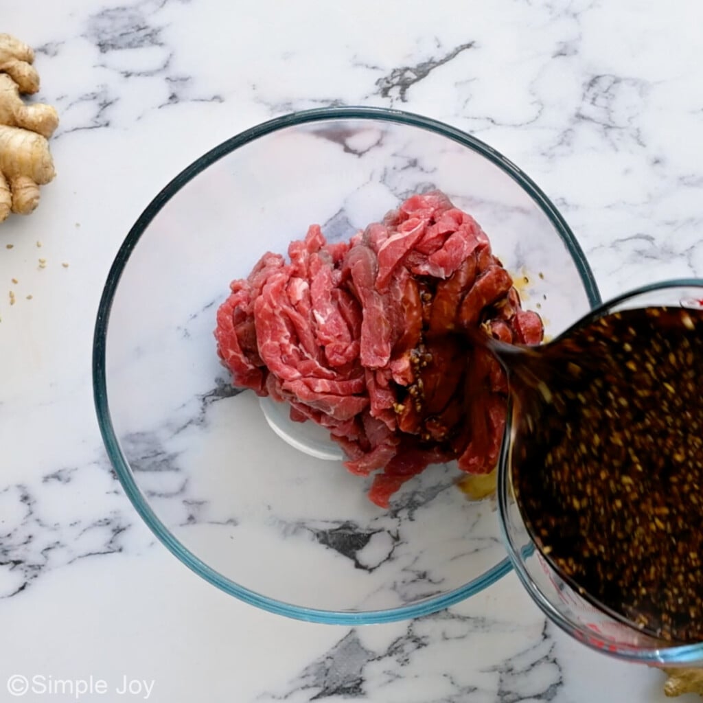teriyaki sauce being poured over cut up steak - 6