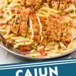 Pinterest graphic for Creamy Cajun Chicken Pasta recipe. Image shows a skillet of Creamy Cajun Chicken Pasta. Text says, "Cajun Chicken Pasta simplejoy.com."