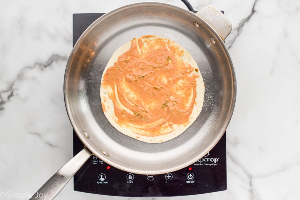 Overhead of skillet of beef quesadilla ingredients