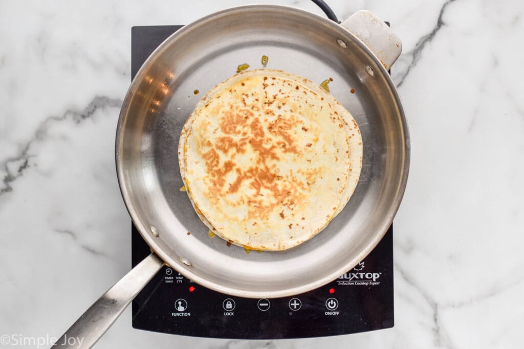 Overhead of skillet of beef quesadilla ingredients
