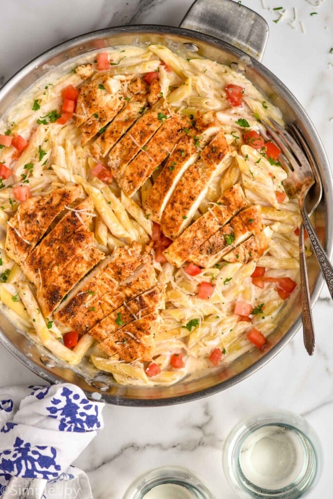 Overhead view of a skillet with forks for serving.