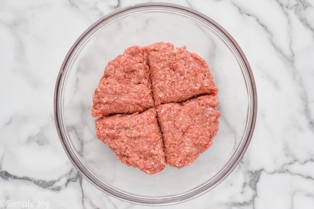overhead of bowl of hamburger meat divided