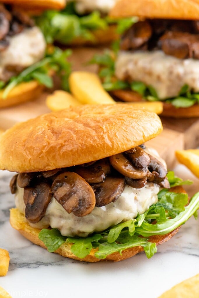 Mushroom Swiss Burger on a bun with lettuce