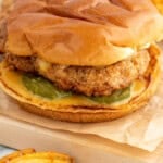 Pinterest graphic for Chicken Sandwich recipe. Image shows Chicken Sandwich on a bun with pickles and chick fil a sauce, waffle fries beside. Text says, "the best Chicken Sandwich simplejoy.com."