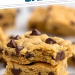 Pinterest graphic for Chocolate Chip Cookie Bars. Says "mouth watering Chocolate Chip Cookie Bars simplejoy.com" Image shows stack of Chocolate Chip Cookie Bars