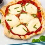 Pinterest graphic for Grilled Pizza recipe. Image shows Grilled Pizzas with shredded basil and cheese. Text says, "Grilled Pizza simplejoy.com"