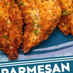 Pinterest graphic for Parmesan Crusted Chicken. Image shows close up of Parmesan Crusted Chicken on a plate. Says "Parmesan Crusted Chicken simplejoy.com"