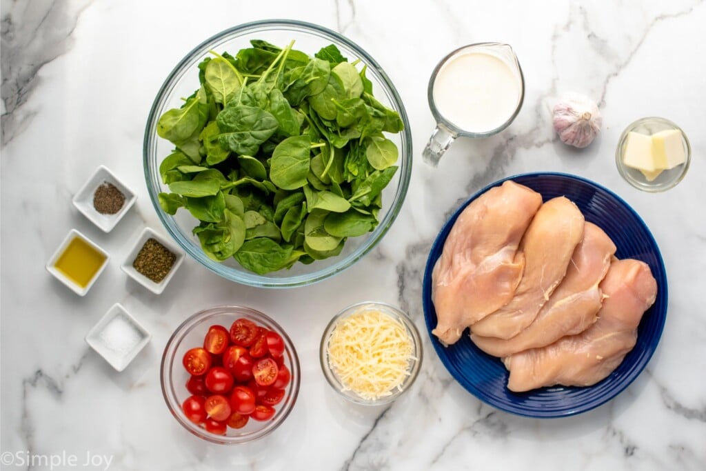 Overhead view of ingredients on countertop for Tuscan Chicken recipe.