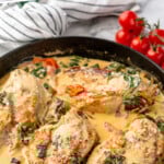 Pinterest graphic for Tuscan Chicken recipe. Text says, "the best Tuscan Chicken simplejoy.com." Image shows a skillet of Tuscan Chicken with cherry tomatoes beside.