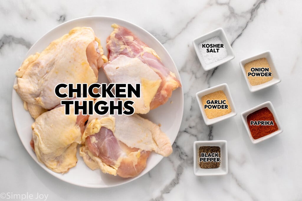 Overhead view of ingredients for Air Fryer Chicken Thighs recipe on countertop.