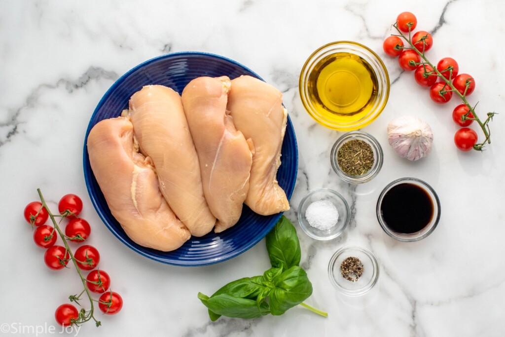 Overhead view of ingredients on countertop for Bruschetta Chicken recipe.