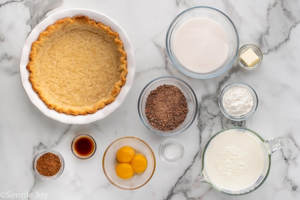 Overhead view of ingredients on countertop for Chocolate Cream Pie recipe.