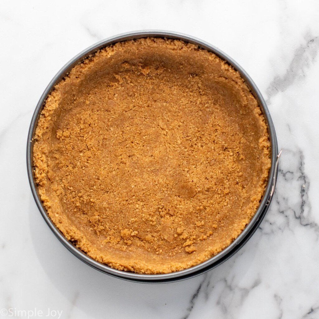 Overhead view of graham pie crust for Strawberry Cheesecake recipe.