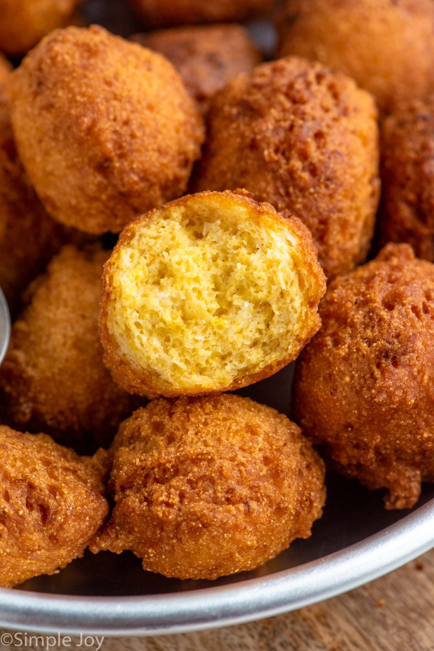 Close up photo of Hush Puppies with one broken in half
