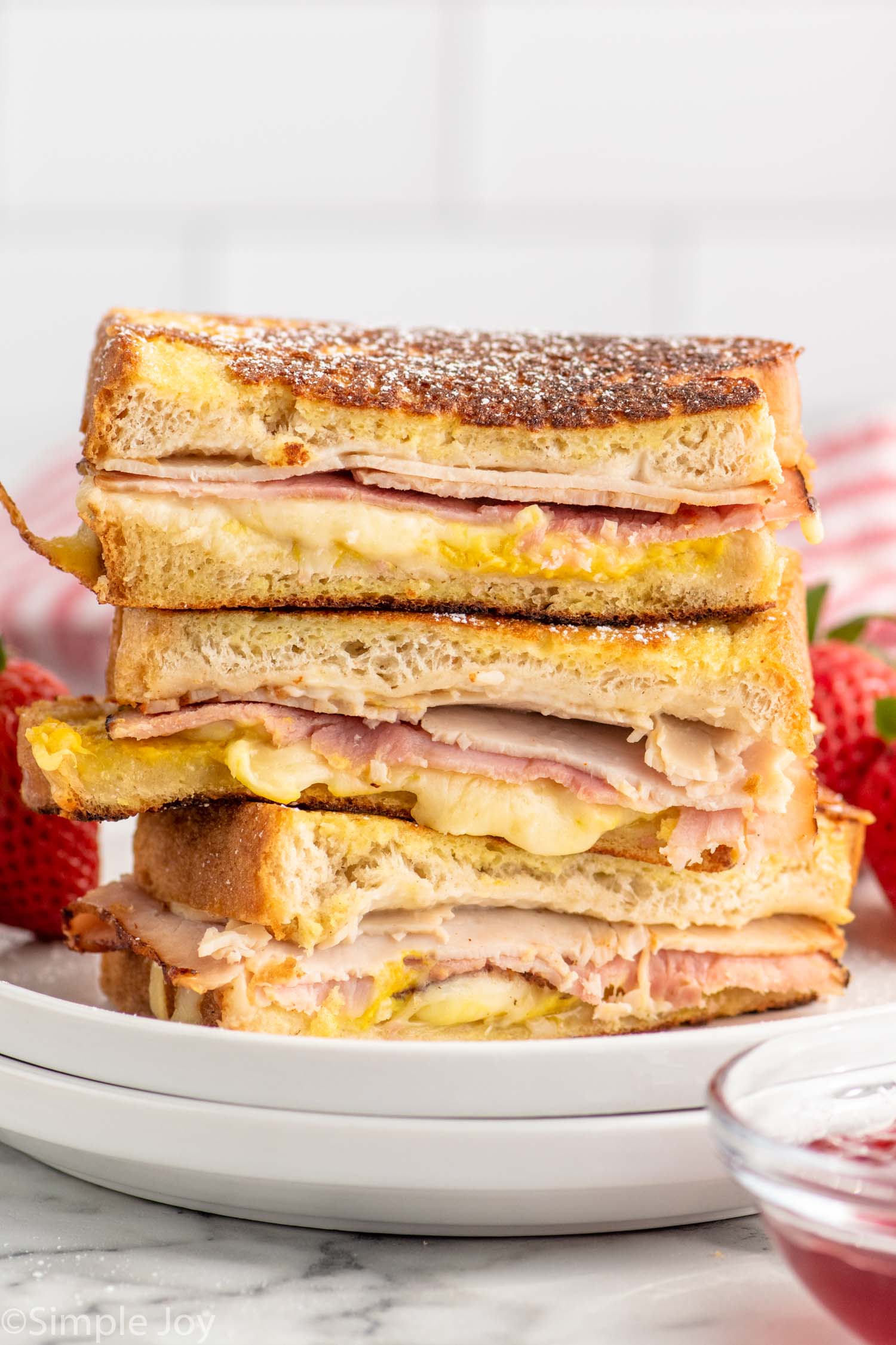 side view of stack of Monte Cristo Sandwiches cut in half