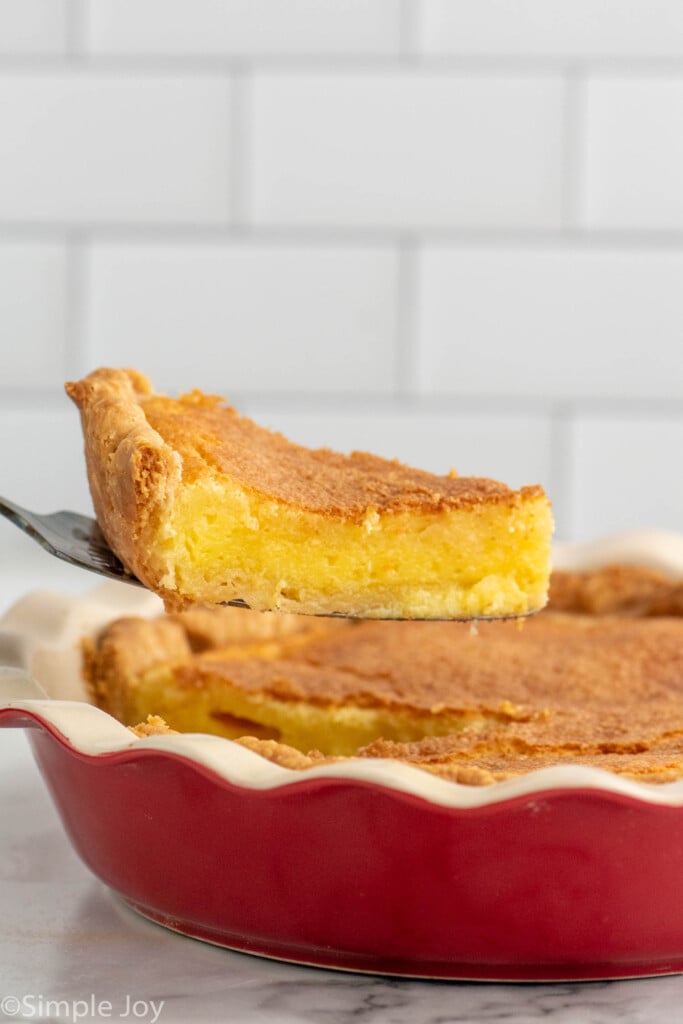 Slice of Chess Pie being lifted from Chess Pie for serving.