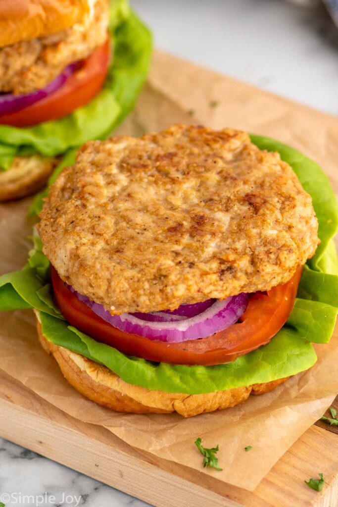 Air Fryer Turkey Burger served on a bun with lettuce, tomato, and onion--no top bun.