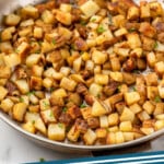 Pinterest graphic for Home Fries recipe. Image shows a skillet of Home Fries. Text says, "the best Home Fries simplejoy.com."
