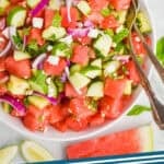 Pinterest graphic of overhead of a bowl of watermelon salad, says: the best watermelon salad simplejoy.com