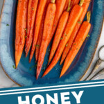Pinterest graphic for Honey Roasted Carrots recipe. Image is overhead view of a platter of Honey Roasted Carrots. Text says, "Honey Roasted Carrots simplejoy.com."