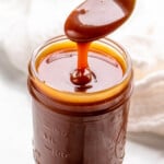 Photo of a jar of caramel sauce with a spoon scooping some out - 14