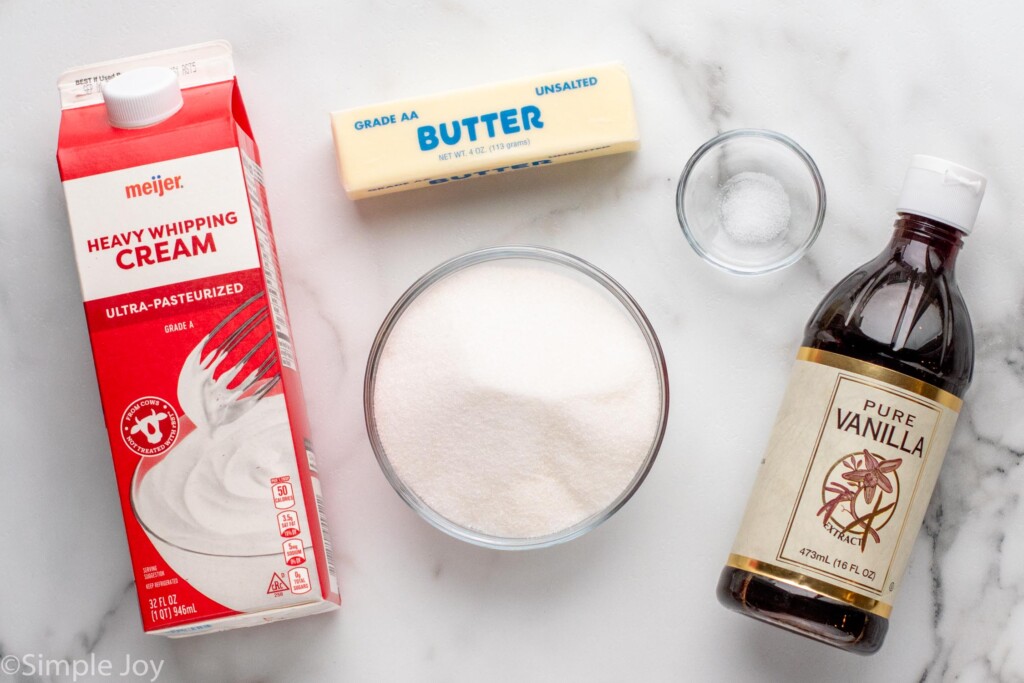 Overhead view of ingredients for caramel sauce recipe on countertop. - 5