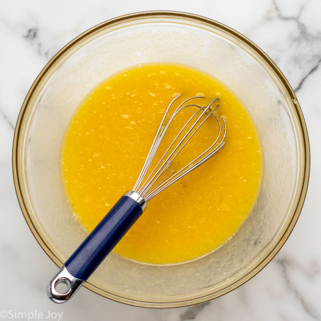 overhead of a of the wet ingredients for chess pie in a bowl