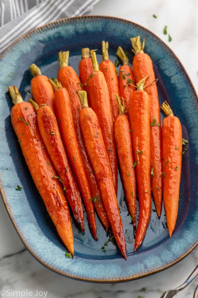 Overhead view of a platter with Honey Roasted Carrots on it.