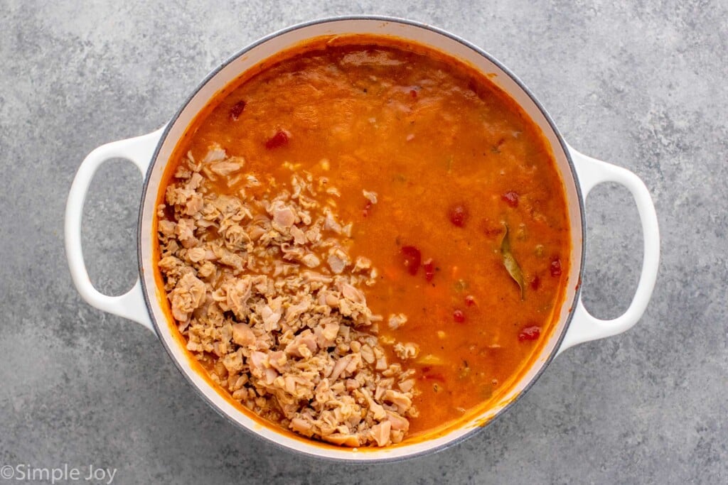 Overhead view of ingredients for Manhattan Clam Chowder in a pot - 10