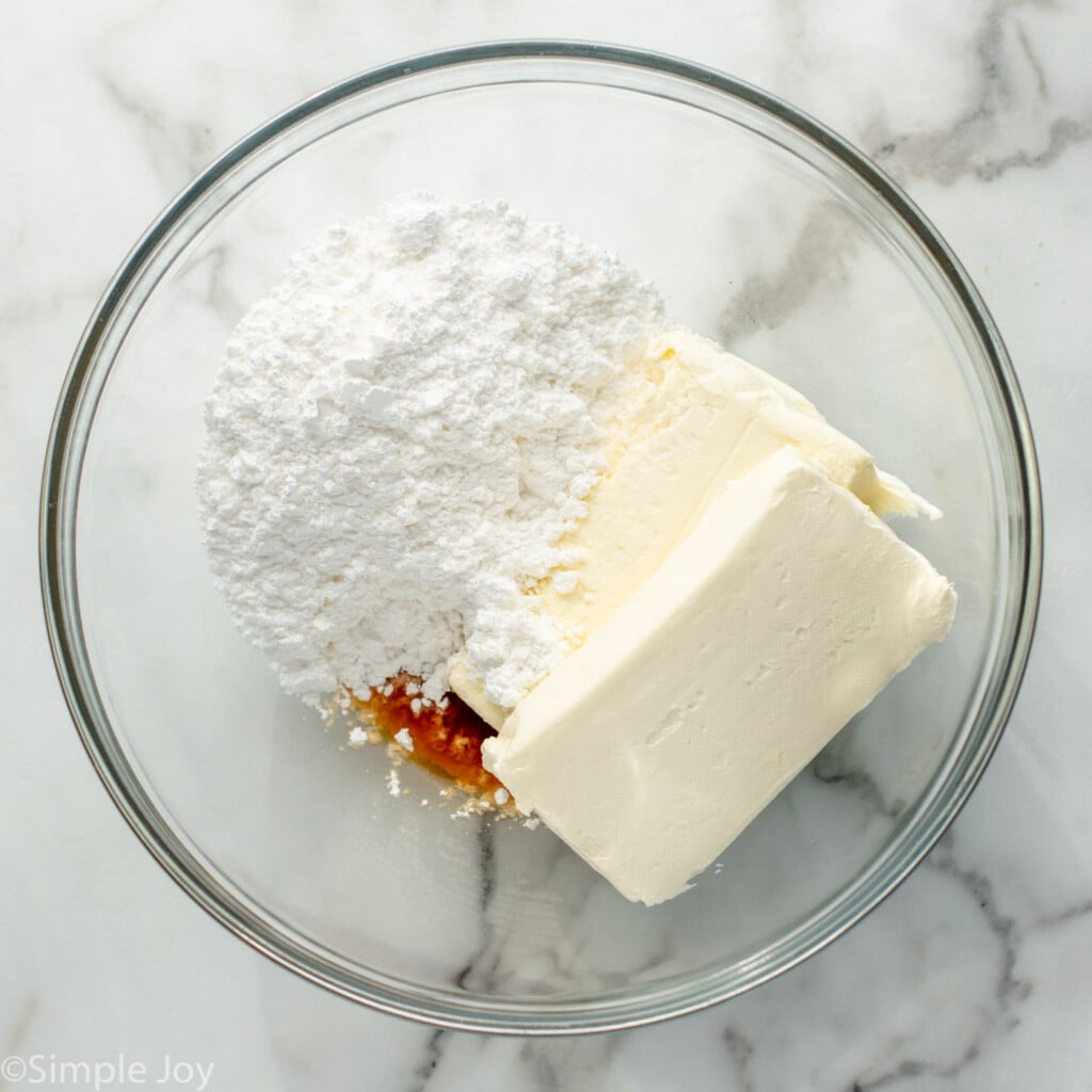 Overhead view of mixing bowl with ingredients for No Bake Cheesecake recipe - 9