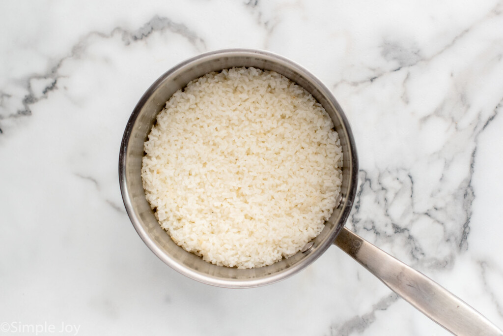 Overhead view of a saucepan of rice for Sushi Bowl recipe - 4
