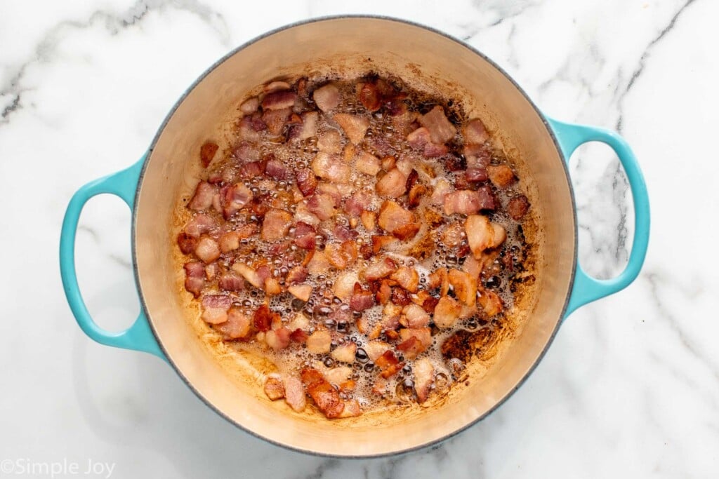 Overhead view of a pot of bacon for Zuppa Toscana recipe. - 5