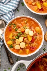 Overhead view of a bowl of Manhattan Clam Chowder with a spoon beside - 12