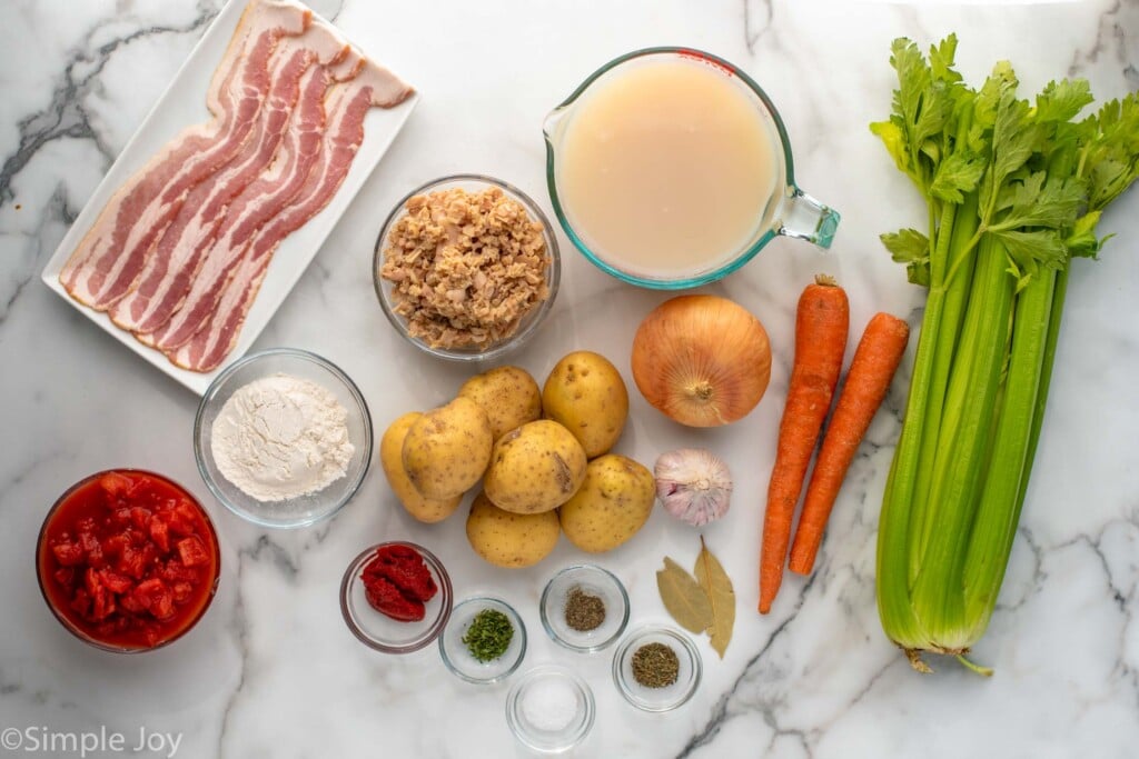 Overhead view of ingredients for Manhattan Clam Chowder recipe on countertop - 4