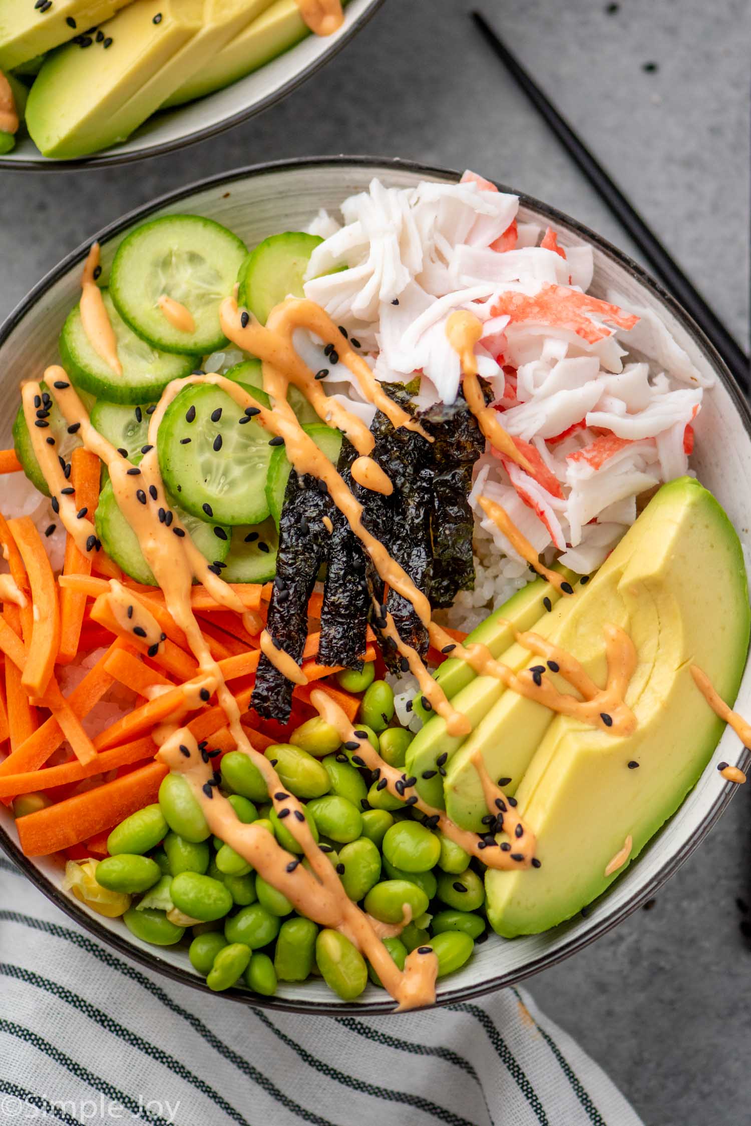 Overhead view of Sushi Bowl garnished with sriracha mayo