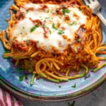 Pinterest graphic for Baked Spaghetti recipe. Image shows a plate of Baked Spaghetti with fork. Text says, "delicious Baked Spaghetti simplejoy.com"