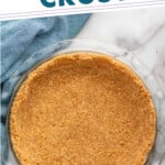 Pinterest graphic for graham cracker crust recipe. Text says, "the best graham cracker crust simplejoy.com." Image shows overhead view of a pie plate with graham cracker crust.