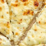 Pinterest graphic for White Pizza recipe. Image is close up view of slices of White Pizza. Text says, "super easy white pizza simplejoy.com."