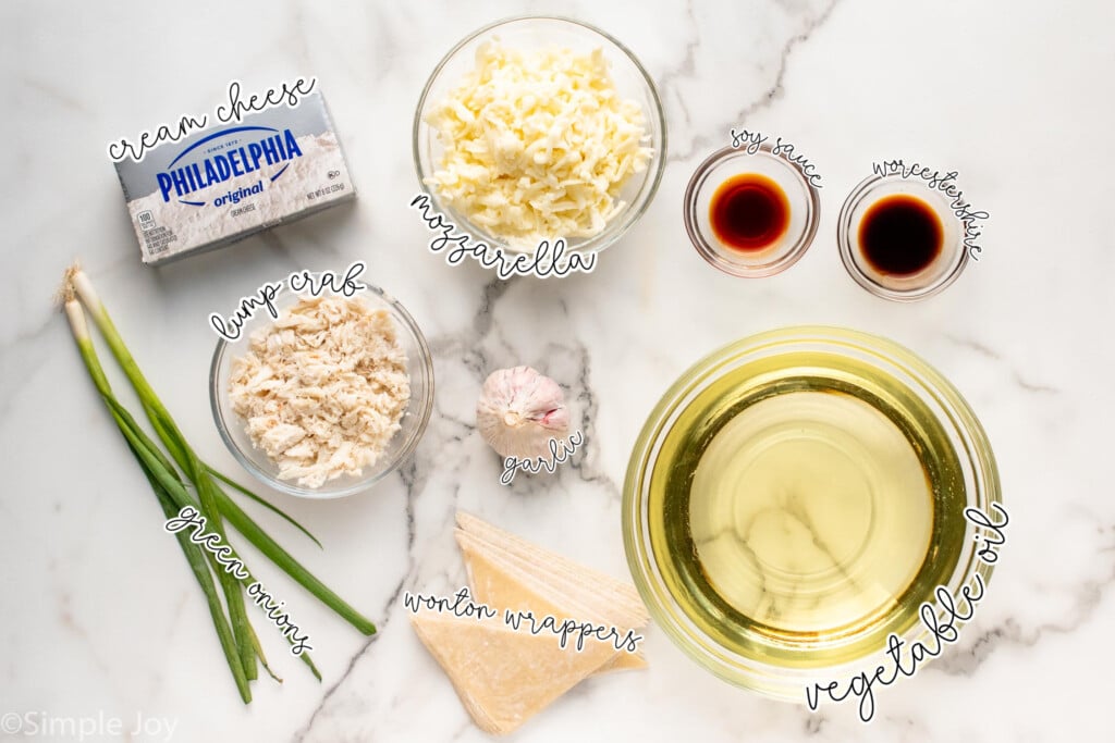 Overhead view of ingredients on countertop for crab rangoon dip recipe. - 5