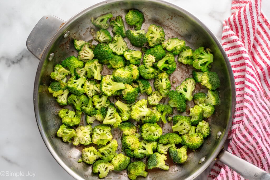Overhead view of a skillet of broccoli cooking for easy Beef and Broccoli recipe