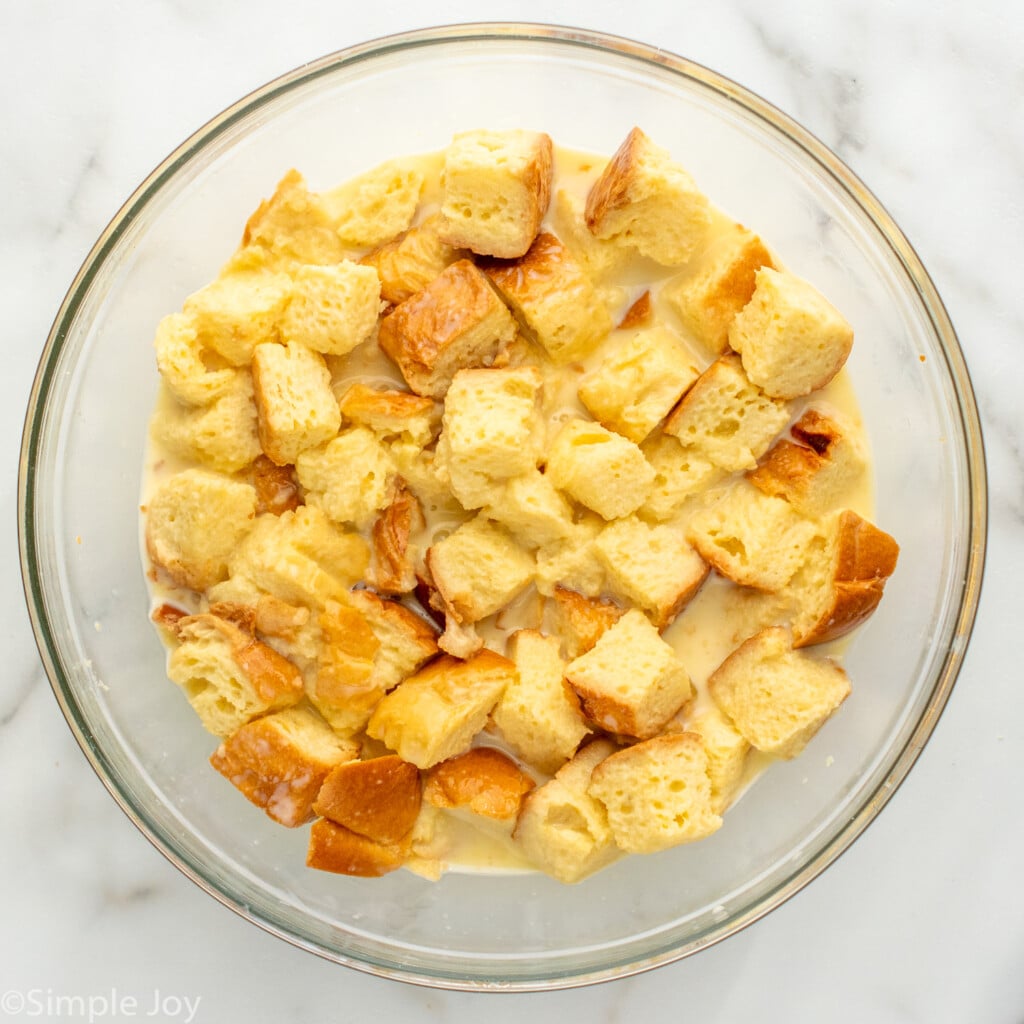 Overhead view of a mixing bowl of bread and pudding for Bread Pudding recipe