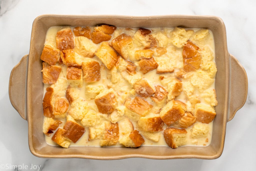 Overhead view of a baking dish of Bread Pudding recipe before baking. - 9
