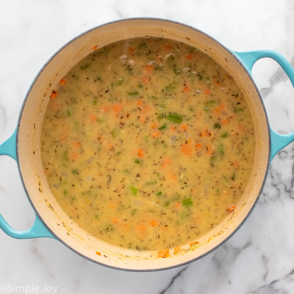 Overhead view of pot of chicken gnocchi soup recipe in process.